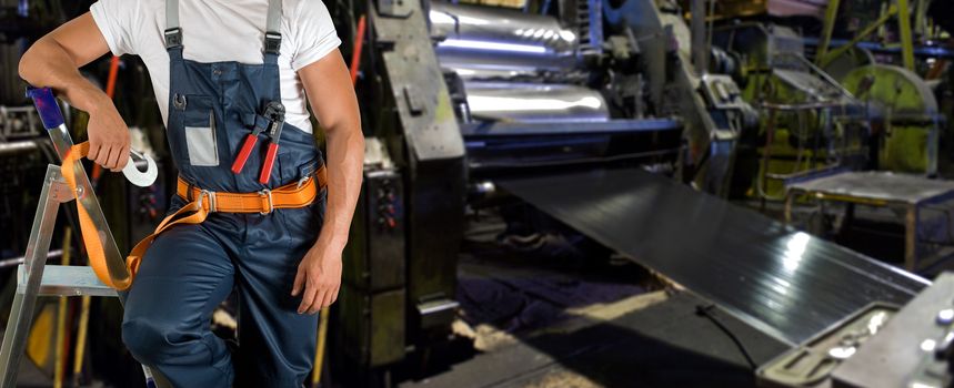 Worker with instruments at industrial factory