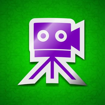 Video camera icon sign. Symbol chic colored sticky label on green background. illustration