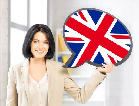 education, foreign language, english, people and communication concept - smiling woman holding text bubble of british flag