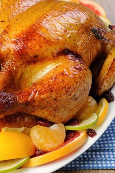 Baked chicken in orange, lime, tangerine and cranberry