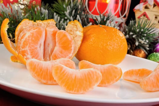 Slices of peeled tangerine on the Christmas table