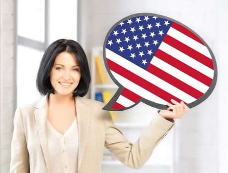 education, foreign language, english, people and communication concept - smiling woman holding text bubble of american flag