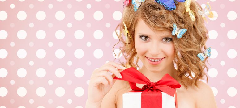 holidays, people and happiness concept - smiling young woman with flowers over pink and white polka dots pattern background