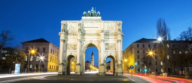 The Siegestor (english: Victory Arch) in Munich. This is a long exposure at dusk with traffic going around the arch