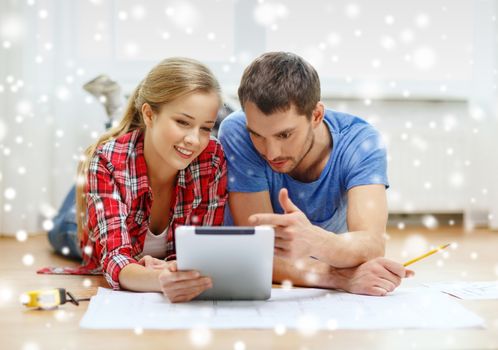 repair, building, renovation, technology and people concept - smiling couple with blueprint looking at tablet pc at home