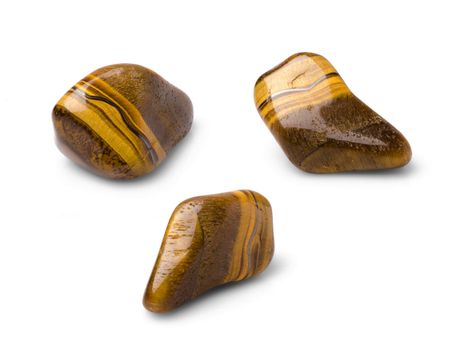 Tiger eye polished gem shot from three points of view isolated on white background.