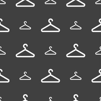 clothes hanger icon sign. Seamless pattern on a gray background. illustration