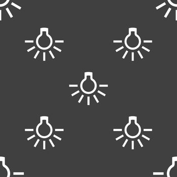 light bulb icon sign. Seamless pattern on a gray background. illustration