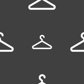 clothes hanger icon sign. Seamless pattern on a gray background. illustration