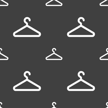 clothes hanger icon sign. Seamless pattern on a gray background. illustration