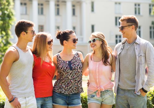 friendship, leisure, summer and people concept - group of smiling friends outdoors