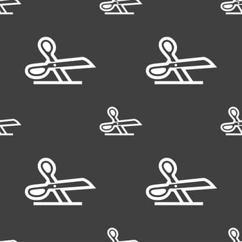 scissors icon sign. Seamless pattern on a gray background. illustration