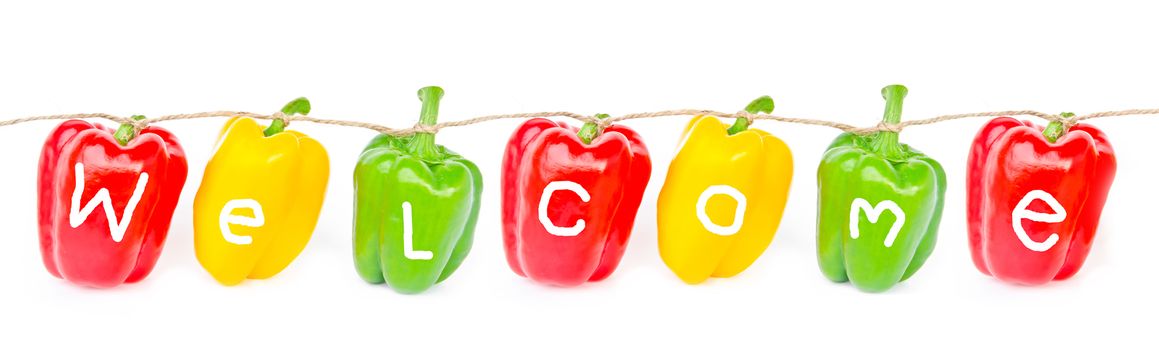 welcome wording on bell peppers, isolated on white background