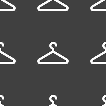 clothes hanger icon sign. Seamless pattern on a gray background. illustration