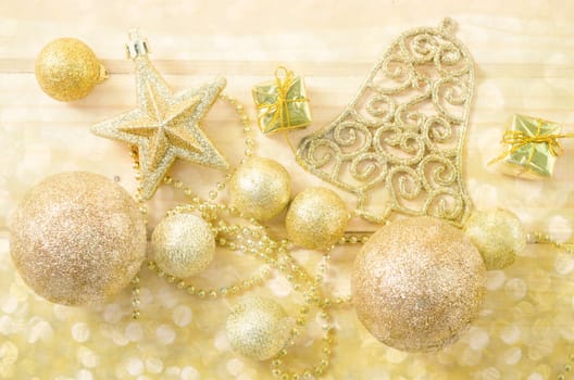 Golden Christmas background with bokeh light.