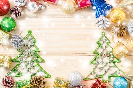 Colorful christmas decoration on wooden background with snow.
