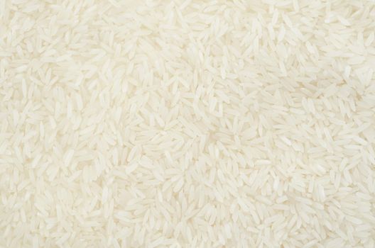 Raw white rice texture as background.