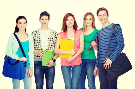 education and people concept - group of smiling students standing