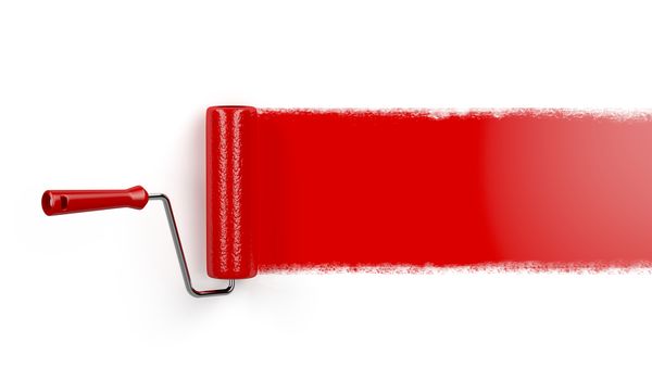 Painting on white wall with paint roller and red paint
