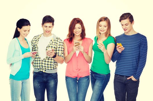 education and modern technology concept - smiling students with smartphones