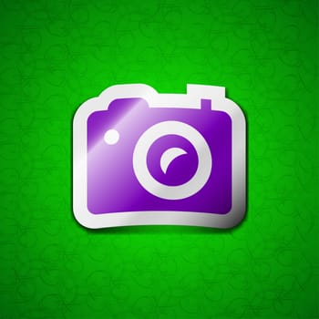 Digital photo camera icon sign. Symbol chic colored sticky label on green background. illustration