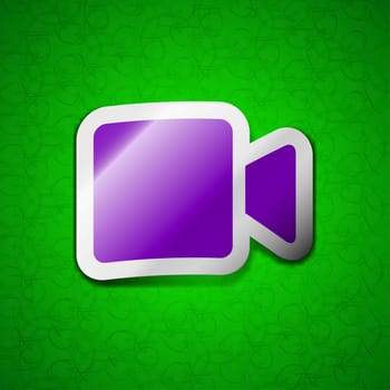 Video camera icon sign. Symbol chic colored sticky label on green background. illustration