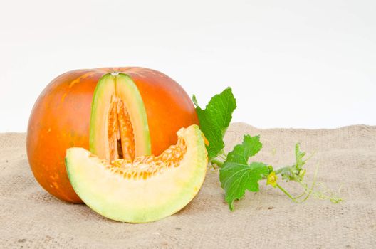 Thai cantaloupe melon and slice on sacks with white background