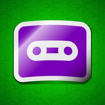 Cassette icon sign. Symbol chic colored sticky label on green background. illustration