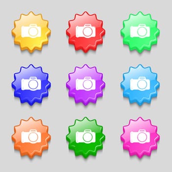 Photo camera sign icon. Digital photo camera symbol. Symbols on nine wavy colourful buttons. illustration