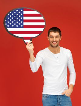 education, foreign language, english, people and communication concept - smiling young man holding text bubble of american flag