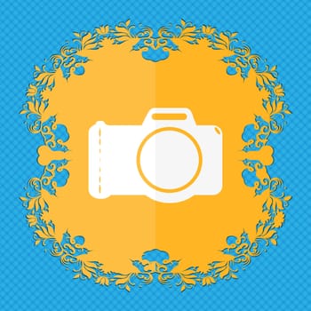 Photo camera sign icon. Digital photo camera symbol. Floral flat design on a blue abstract background with place for your text. illustration