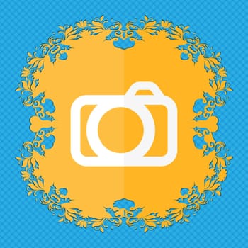 Photo camera sign icon. Digital photo camera symbol. Floral flat design on a blue abstract background with place for your text. illustration