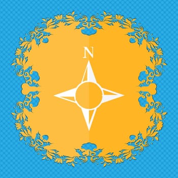 Compass sign icon. Windrose navigation symbol. Floral flat design on a blue abstract background with place for your text. illustration