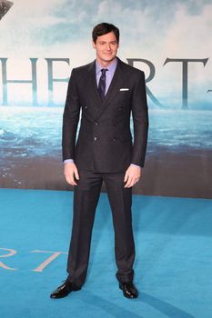 UNITED KINGDOM, London: American actor Ben Walker poses for photographers during the premier of In the Heart of the Sea, a Ron Howard movie, in London on December 2nd, 2015.