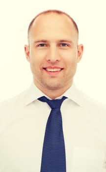 business, education and office concept - portrait of smiling businessman