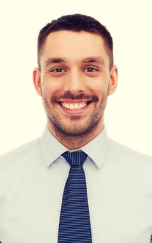 business, education and office concept - portrait of smiling businessman