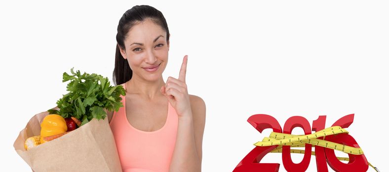 Slim woman holding bag with healthy food against white background with vignette