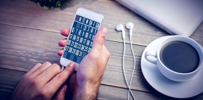 Technology lock screen against person using smart next to coffee mug at desk