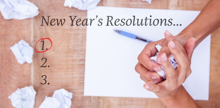 New years resolution list against close up view of a paper ball