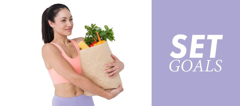 Slim woman holding bag with healthy food against purple vignette