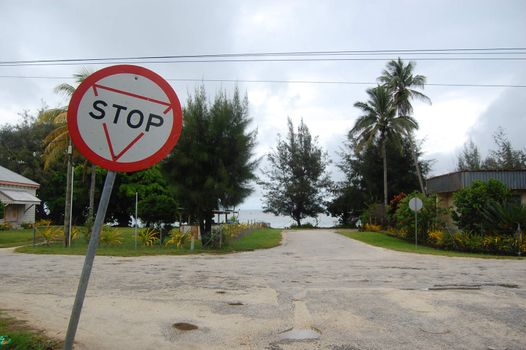 Stop sign at road junction Tonga, Lifuka Island