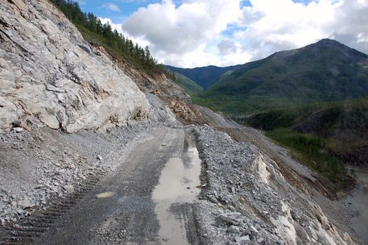 Mountain gravel road at Kolyma state highway, Russia outback