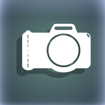 Photo camera sign icon. Digital photo camera symbol. On the blue-green abstract background with shadow and space for your text. illustration