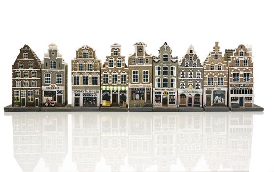 miniature model houses , shops as in old Amsterdam Holland isolated on white background