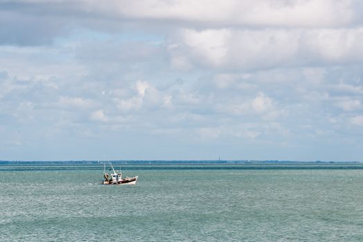 Small fishing boat off the island of Noirmoutier, France. Film emulation fiter applied.
