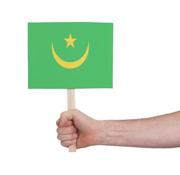 Hand holding small card, isolated on white - Flag of Mauritania