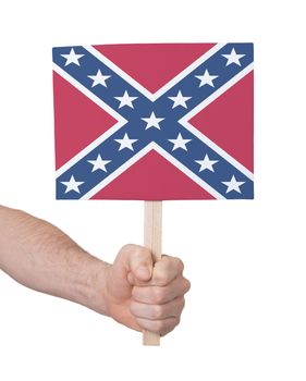 Hand holding small card, isolated on white - Flag of the Confederacy