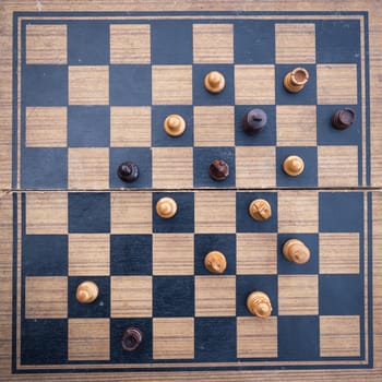 Wooden Chess board Business strategy idea concept background. Vintage dark corner style .