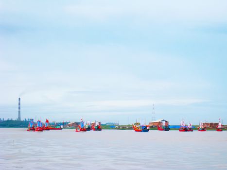 HAI DUONG, VIETNAM, March 2: Performed traditional boat on the Luc Dau river on March 2, 2013 in Kiep Bac – Con Son festival, Chi Linh, Hai Duong, Vietnam. Kiep Bac – Con Son festival is the most traditional festival, unique in Vietnam, held in spring and autumn every year. Perform traditional boat to recreate the naval battle in the history of the 14th century of Tran Hung Dao, a national hero of Vietnam, 1 in 10 of the world's great general by the Science Council of British Royal considered for February 1984