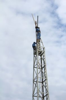 KHANH HOA, VIETNAM, September, 17: Workers fixing wind propeller on September, 17, 2013 in Khanh Hoa, Vietnam